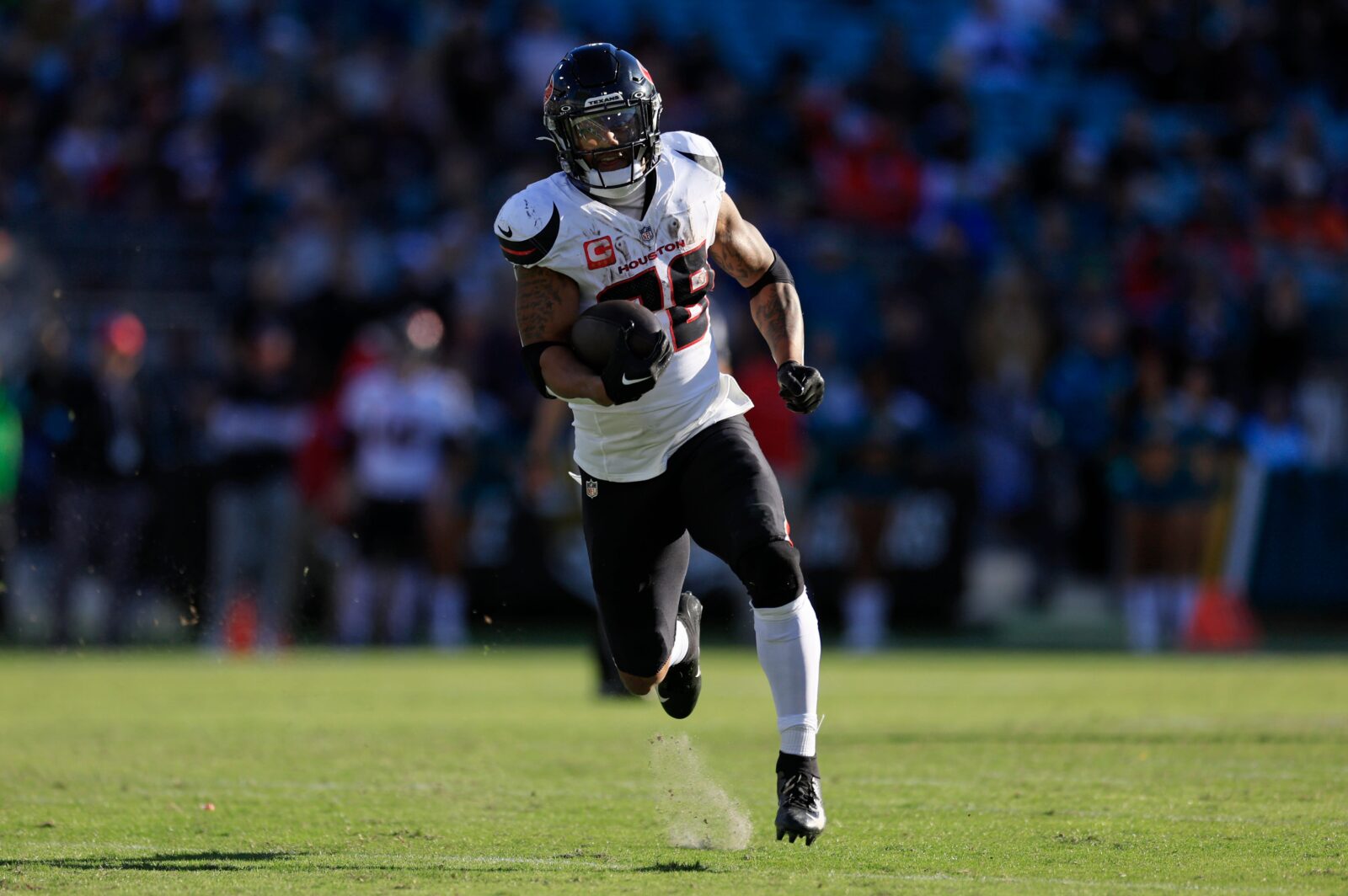 Houston Texans running back Joe Mixon (28) scores a touchdown during the third quarter of an NFL football matchup Sunday, Dec. 1, 2024 at EverBank Stadium in Jacksonville, Fla. The Texans held off the Jaguars 23-20.