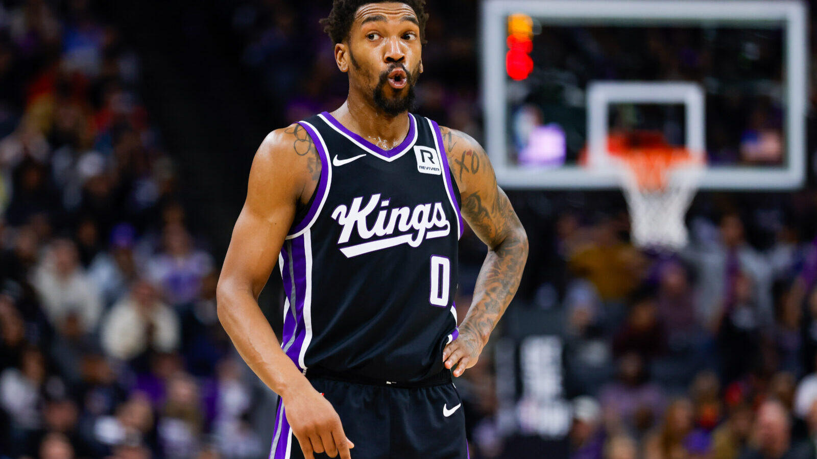 Jan 16, 2025; Sacramento, California, USA; Sacramento Kings guard Malik Monk (0) reacts after a play during the fourth quarter against the Houston Rockets at Golden 1 Center.