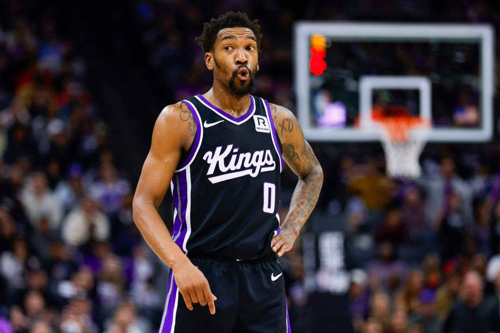 Jan 16, 2025; Sacramento, California, USA; Sacramento Kings guard Malik Monk (0) reacts after a play during the fourth quarter against the Houston Rockets at Golden 1 Center.