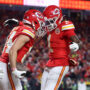 Jan 26, 2025; Kansas City, MO, USA; Kansas City Chiefs wide receiver Justin Watson (84) reacts with wide receiver Xavier Worthy (1) after making a catch for a two point conversion against the Buffalo Bills during the second half in the AFC Championship game at GEHA Field at Arrowhead Stadium.