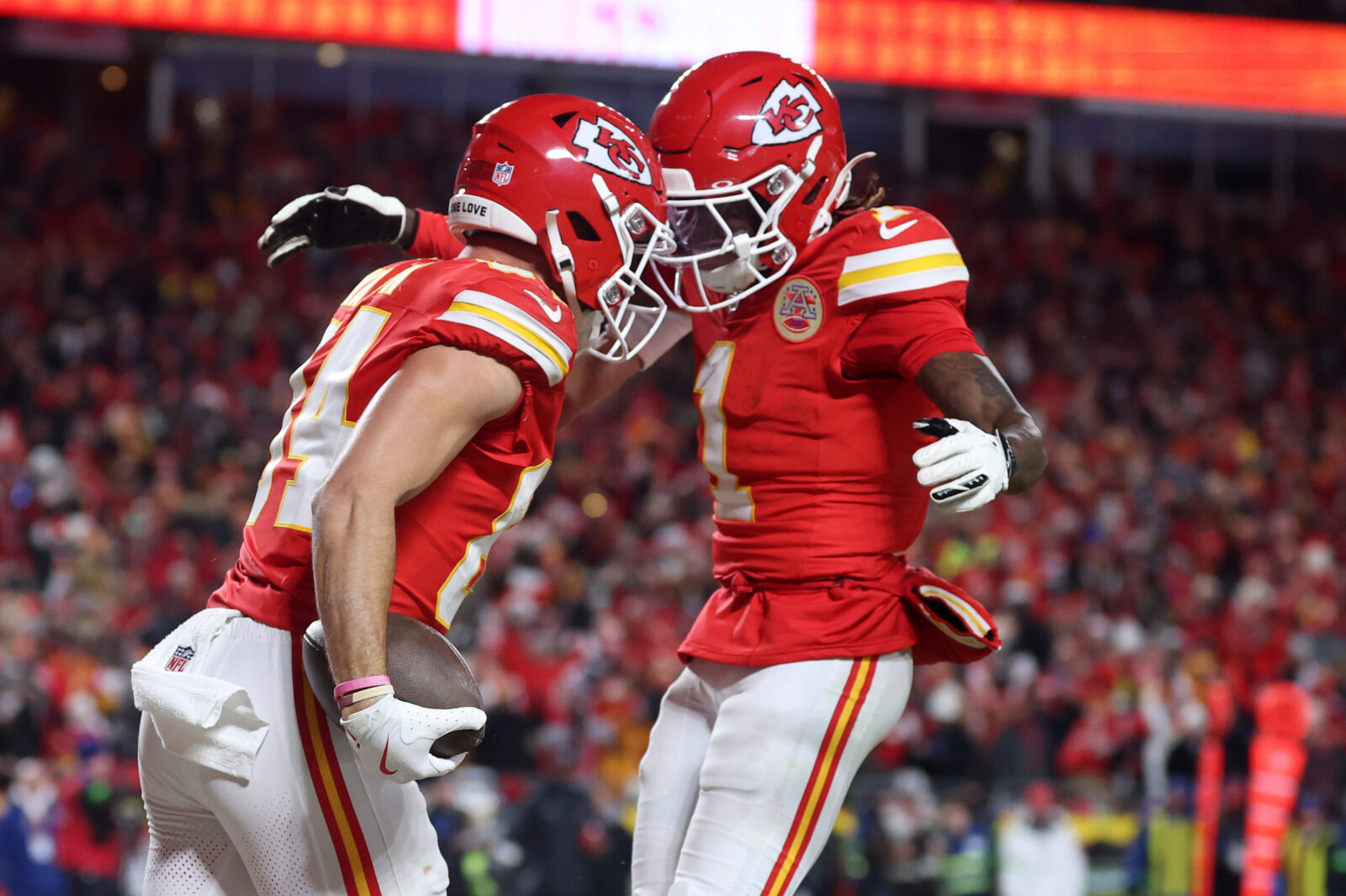 Jan 26, 2025; Kansas City, MO, USA; Kansas City Chiefs wide receiver Justin Watson (84) reacts with wide receiver Xavier Worthy (1) after making a catch for a two point conversion against the Buffalo Bills during the second half in the AFC Championship game at GEHA Field at Arrowhead Stadium.