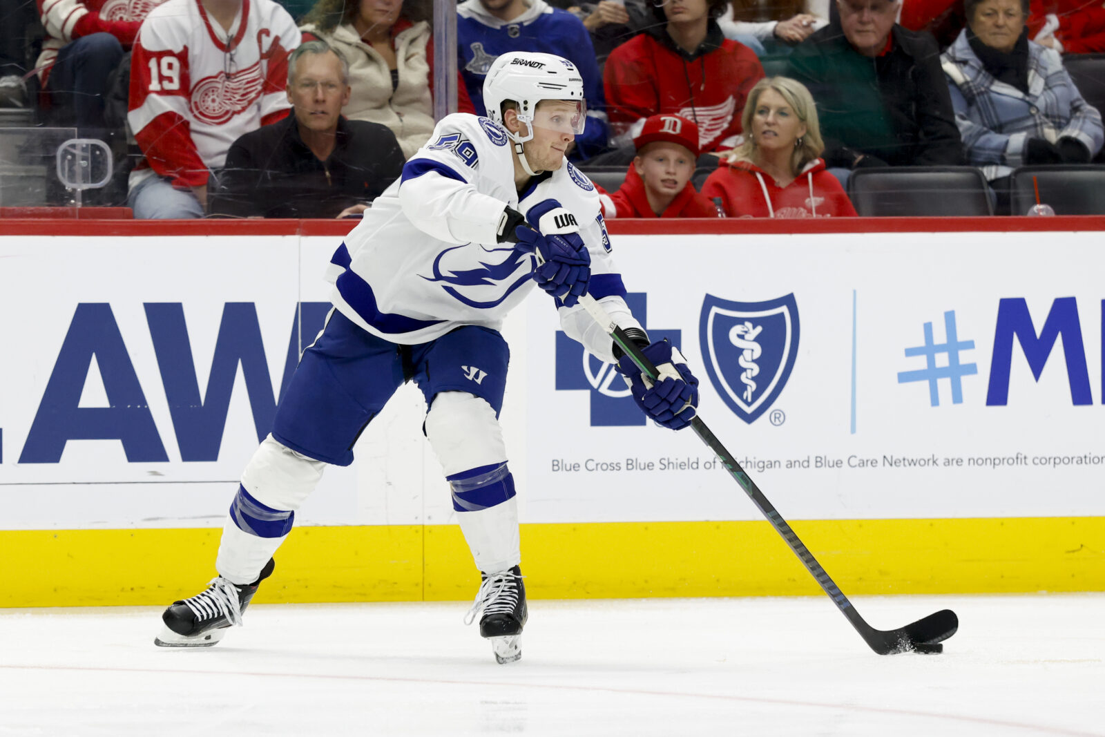 Feb 8, 2025; Detroit, Michigan, USA; Tampa Bay Lightning center Jake Guentzel (59) skates with the puck in the third period against the Detroit Red Wings at Little Caesars Arena.