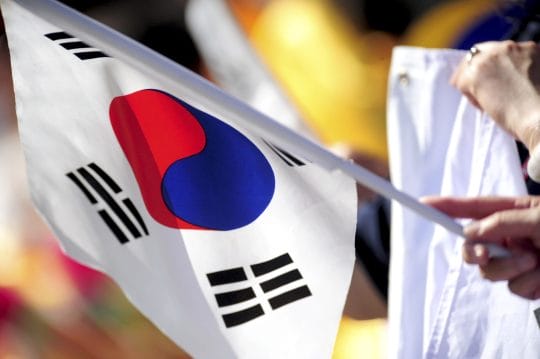 Aug 24, 2014; South Williamsport, PA, USA; A fan holds a Korean flag during the game between the Asia-Pacific Region and the Great Lakes Region at Howard J. Lamade Stadium.