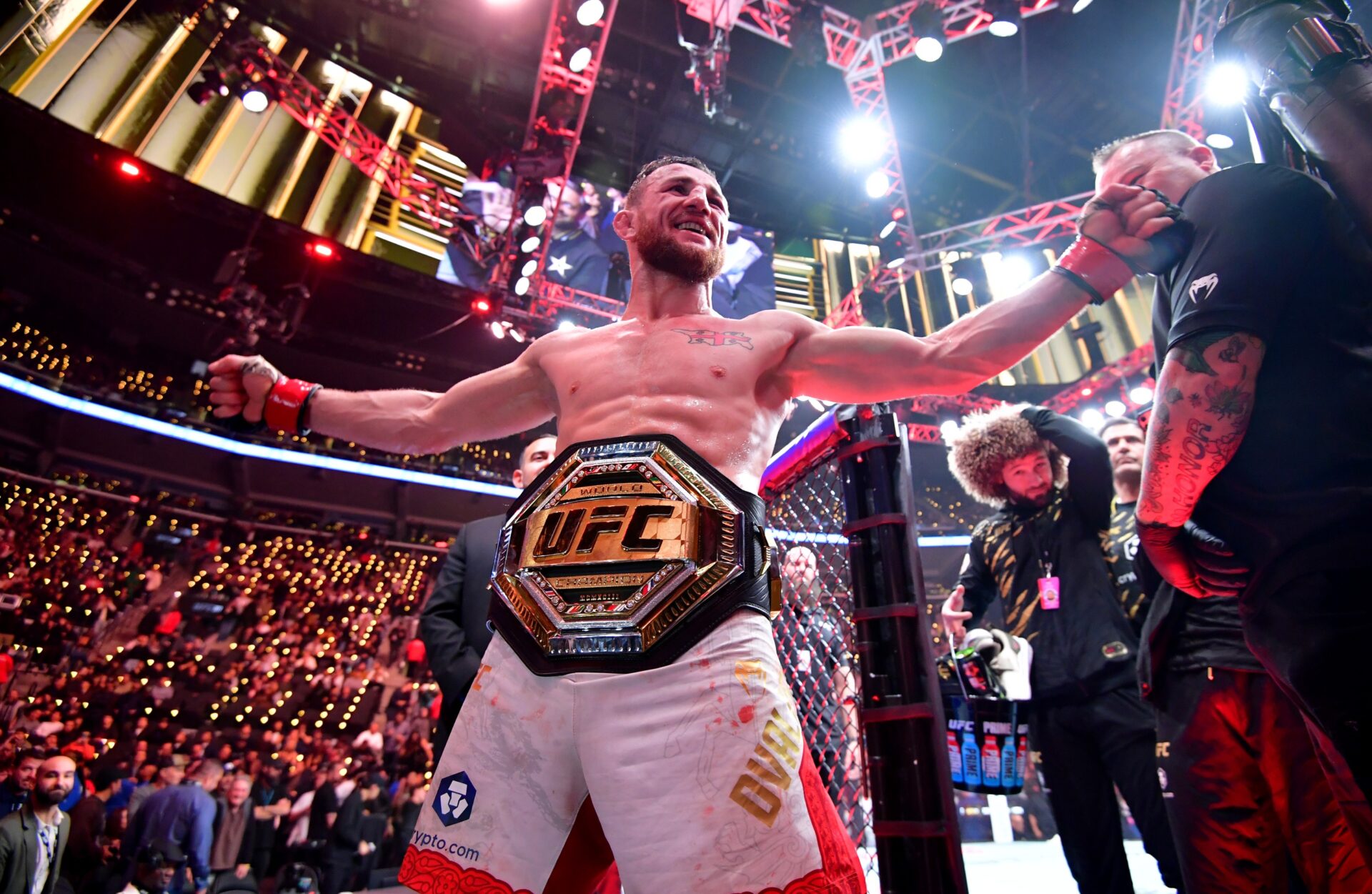 Jan 18, 2025; Inglewood, California, USA; Merab Dvalishvili (red gloves) celebrates after winning a UFC bantamweight title fight against Umar Nurmagomedov (not pictured) during UFC 311 at Intuit Dome.
