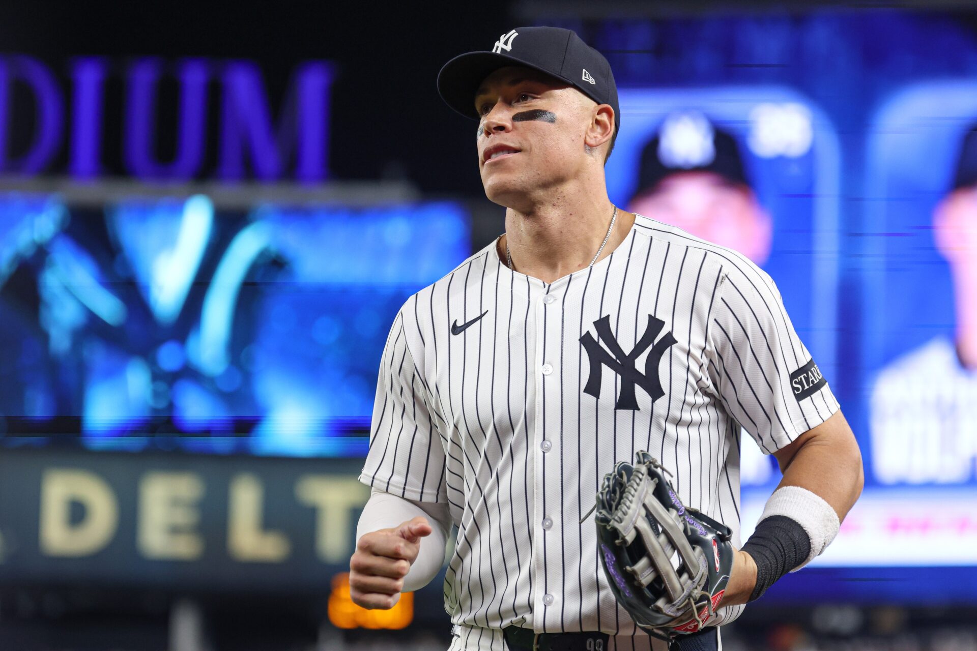 Bronx, New York, USA; New York Yankees right fielder Aaron Judge (99) runs in from the field after the top of the eighth inning against the Tampa Bay Rays at Yankee Stadium.