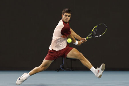 Mar 21, 2025; Miami, FL, USA; Carlos Alcaraz (ESP) reaches for a backhand against David Goffin (BEL)(not pictured) on day four of the Miami Open at Hard Rock Stadium.