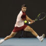 Mar 21, 2025; Miami, FL, USA; Carlos Alcaraz (ESP) reaches for a backhand against David Goffin (BEL)(not pictured) on day four of the Miami Open at Hard Rock Stadium.