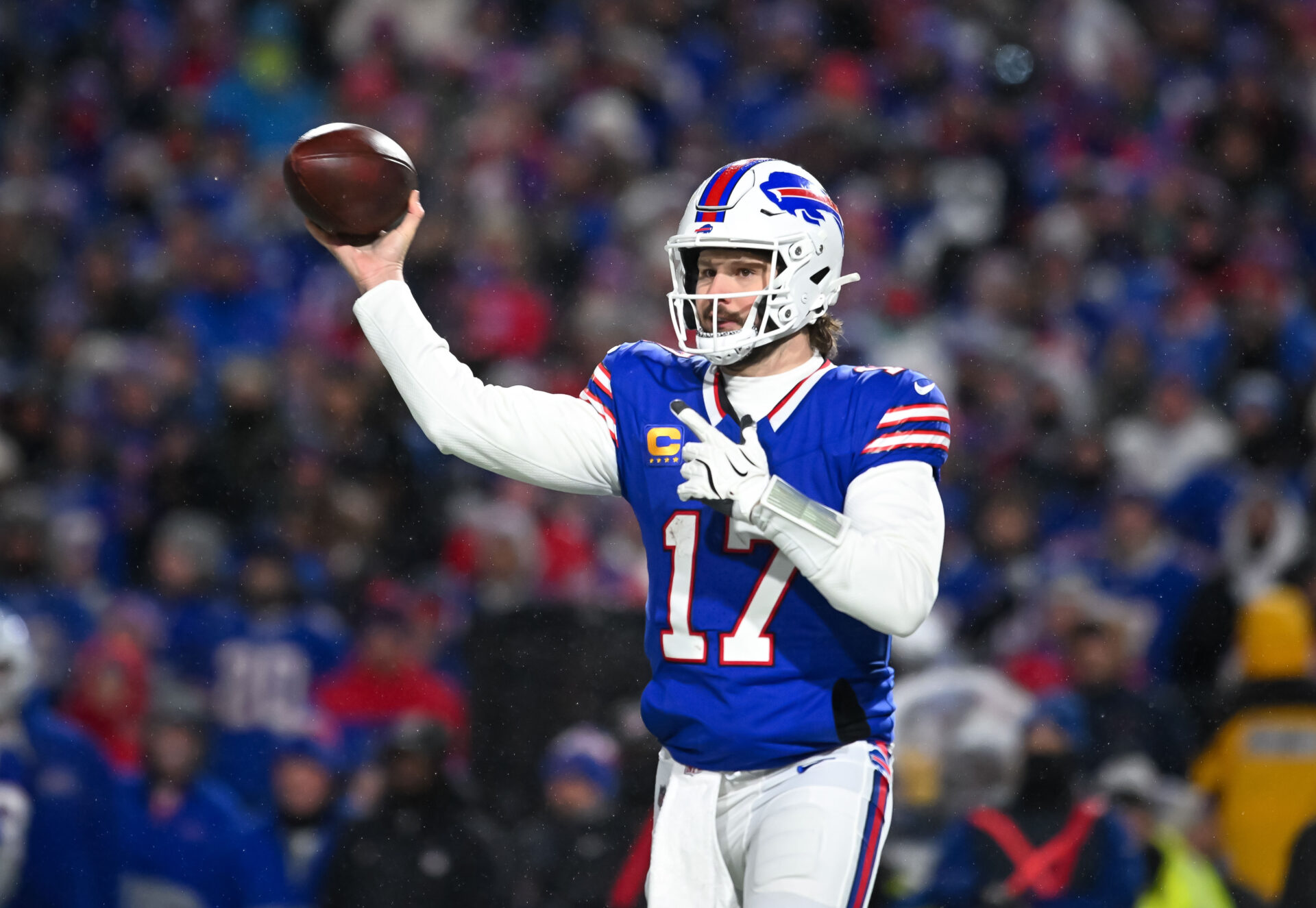 Jan 19, 2025; Orchard Park, New York, USA; Buffalo Bills quarterback Josh Allen (17) throws a pass in the third quarter of a 2025 AFC divisional round game against the Baltimore Ravens at Highmark Stadium.