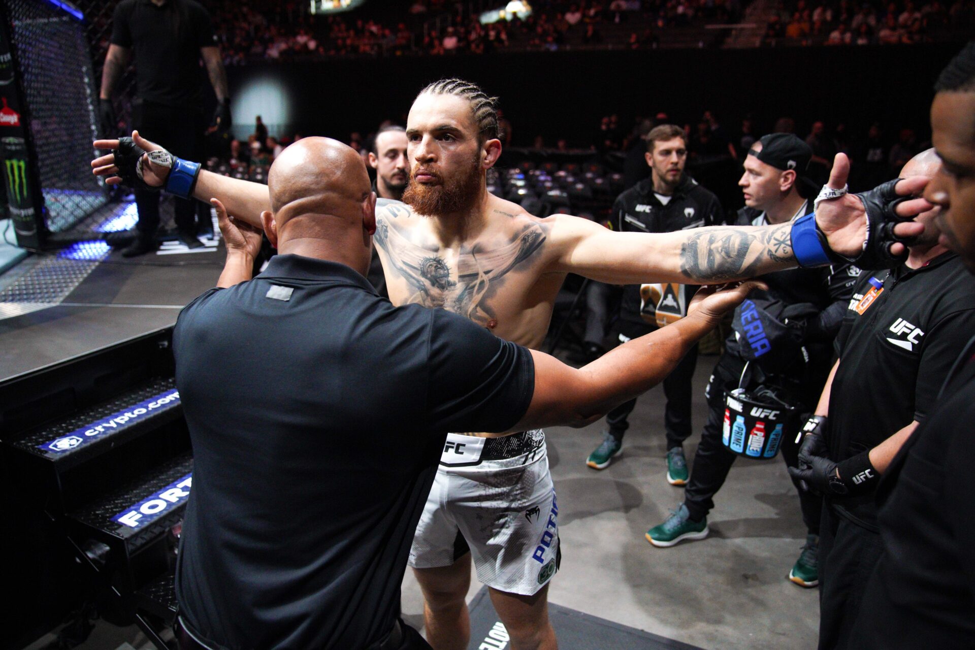 Dec 2, 2023; Austin, Texas, USA; Rodolfo Bellato (red gloves) fights Ihor Potieria (blue gloves) during UFC Fight Night at Moody Center.