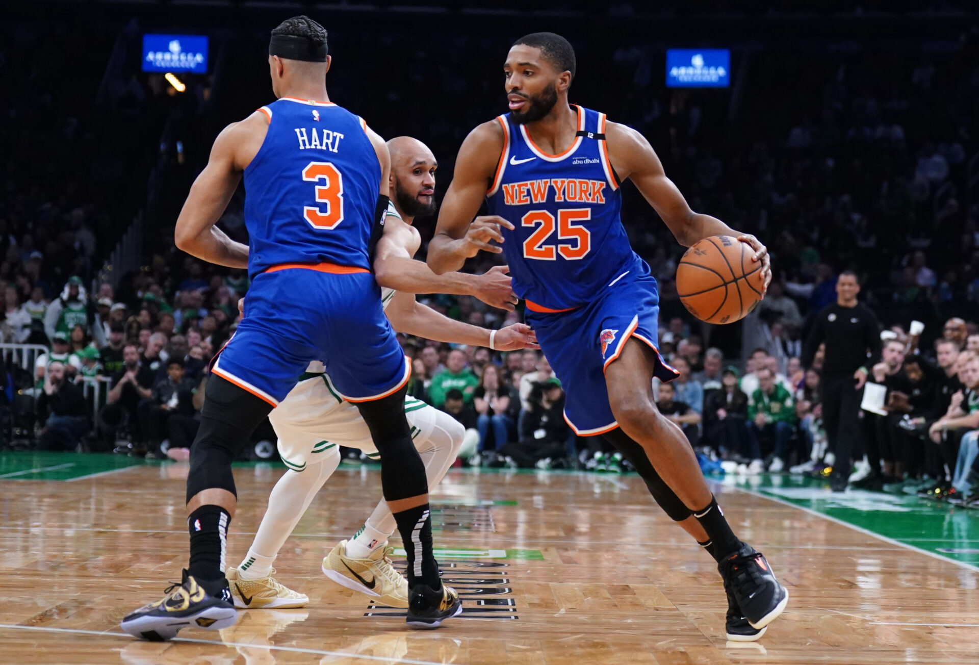 May 5, 2025; Boston, Massachusetts, USA; New York Knicks forward Mikal Bridges (25) drives the ball against Boston Celtics guard Derrick White (9) in the second quarter during game one of the second round for the 2025 NBA Playoffs at TD Garden.