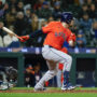 Apr 8, 2025; Seattle, Washington, USA; Houston Astros catcher Victor Caratini (17) hits an RBI-single against the Seattle Mariners during the twelfth inning at T-Mobile Park.