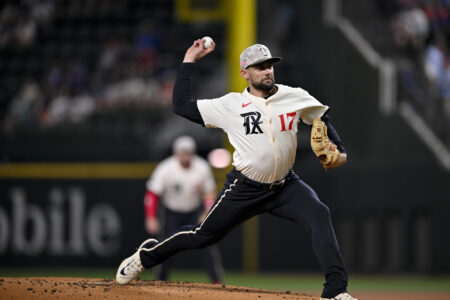 May 16, 2025; Arlington, Texas, USA; Texas Rangers starting pitcher Nathan Eovaldi (17) pitches against the Houston Astros during the first inning at Globe Life Field.