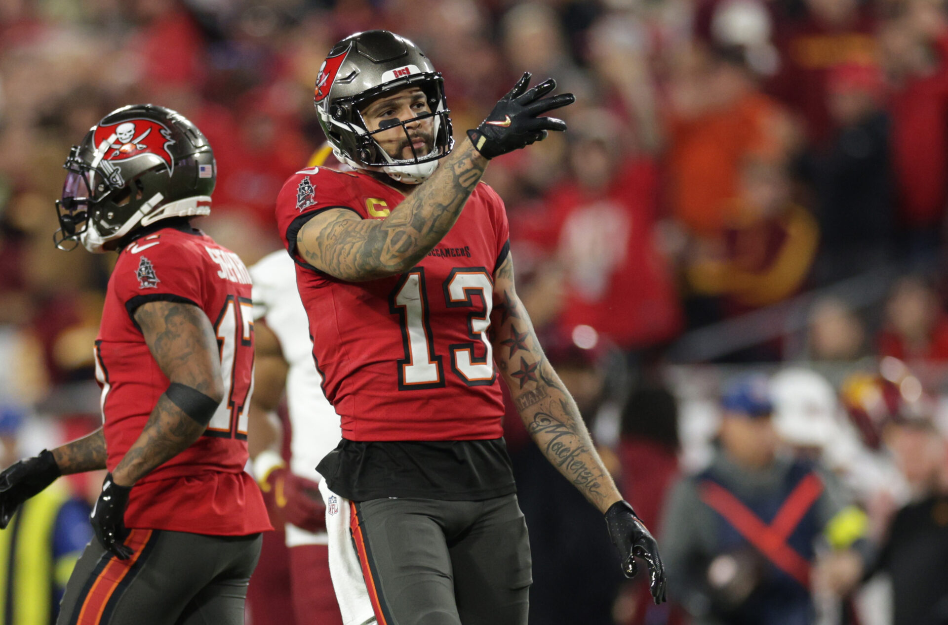 Jan 12, 2025; Tampa, Florida, USA; Tampa Bay Buccaneers wide receiver Mike Evans (13) reacts after a first down during the third quarter of a NFC wild card playoff against the Washington Commanders at Raymond James Stadium.
