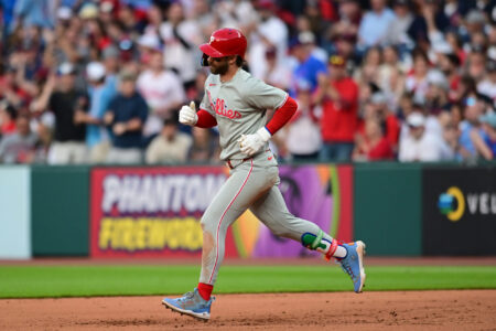 May 10, 2025; Cleveland, Ohio, USA; Philadelphia Phillies first baseman Bryce Harper (3) rounds the bases after hitting a home run during the eighth inning against the Cleveland Guardians at Progressive Field.