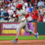 May 10, 2025; Cleveland, Ohio, USA; Philadelphia Phillies first baseman Bryce Harper (3) rounds the bases after hitting a home run during the eighth inning against the Cleveland Guardians at Progressive Field.