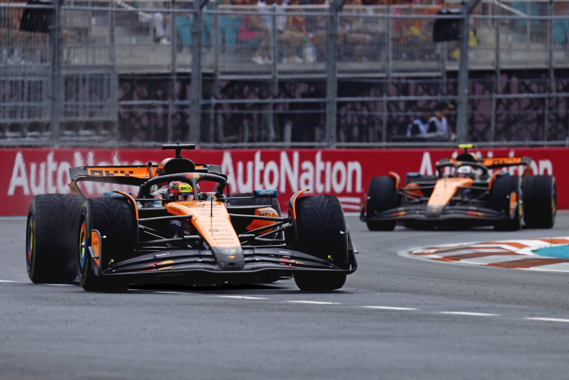 May 3, 2025; Miami Gardens, FL, USA; McLaren driver Oscar Piastri (81) and McLaren driver Lando Norris (4) during the F1 Miami Grand Prix Sprint Race at Miami International Autodrome.