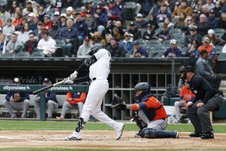 May 4, 2025; Chicago, Illinois, USA; Chicago White Sox center fielder Luis Robert Jr. (88) singles against the Houston Astros during the first inning at Rate Field.