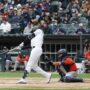 May 4, 2025; Chicago, Illinois, USA; Chicago White Sox center fielder Luis Robert Jr. (88) singles against the Houston Astros during the first inning at Rate Field.