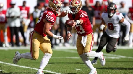 Nov 10, 2024; Tampa, Florida, USA; San Francisco 49ers quarterback Brock Purdy (13) hands off to running back Christian McCaffrey (23) against the Tampa Bay Buccaneers in the third quarter at Raymond James Stadium.