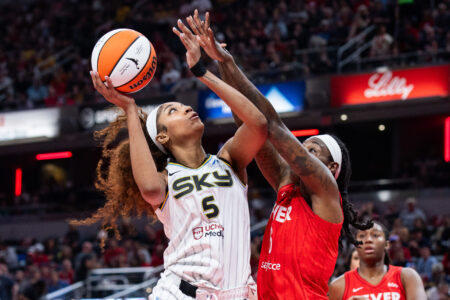 May 17, 2025; Indianapolis, Indiana, USA; Chicago Sky forward Angel Reese (5) shoots the ball while Indiana Fever forward Natasha Howard (6) defends in the second half at Gainbridge Fieldhouse.