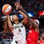 May 17, 2025; Indianapolis, Indiana, USA; Chicago Sky forward Angel Reese (5) shoots the ball while Indiana Fever forward Natasha Howard (6) defends in the second half at Gainbridge Fieldhouse.