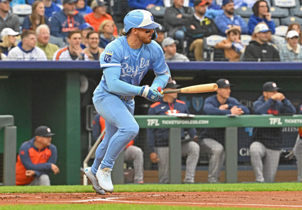 Apr 26, 2025; Kansas City, Missouri, USA; Kansas City Royals shortstop Bobby Witt Jr. (7) doubles in the first inning against the Houston Astros at Kauffman Stadium.