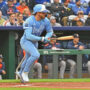 Apr 26, 2025; Kansas City, Missouri, USA; Kansas City Royals shortstop Bobby Witt Jr. (7) doubles in the first inning against the Houston Astros at Kauffman Stadium.