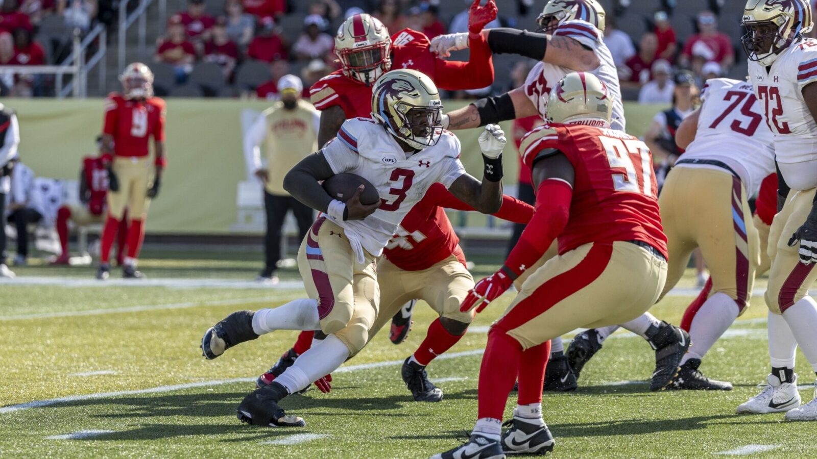 Jun 8, 2025; Birmingham, AL, USA; Michigan Panthers quarterback Bryce Perkins (3) runs the ball against Birmingham Stallions defensive lineman Willie Yarbary (97) during the second half of the USFL conference championship football game at Protective Stadium.
