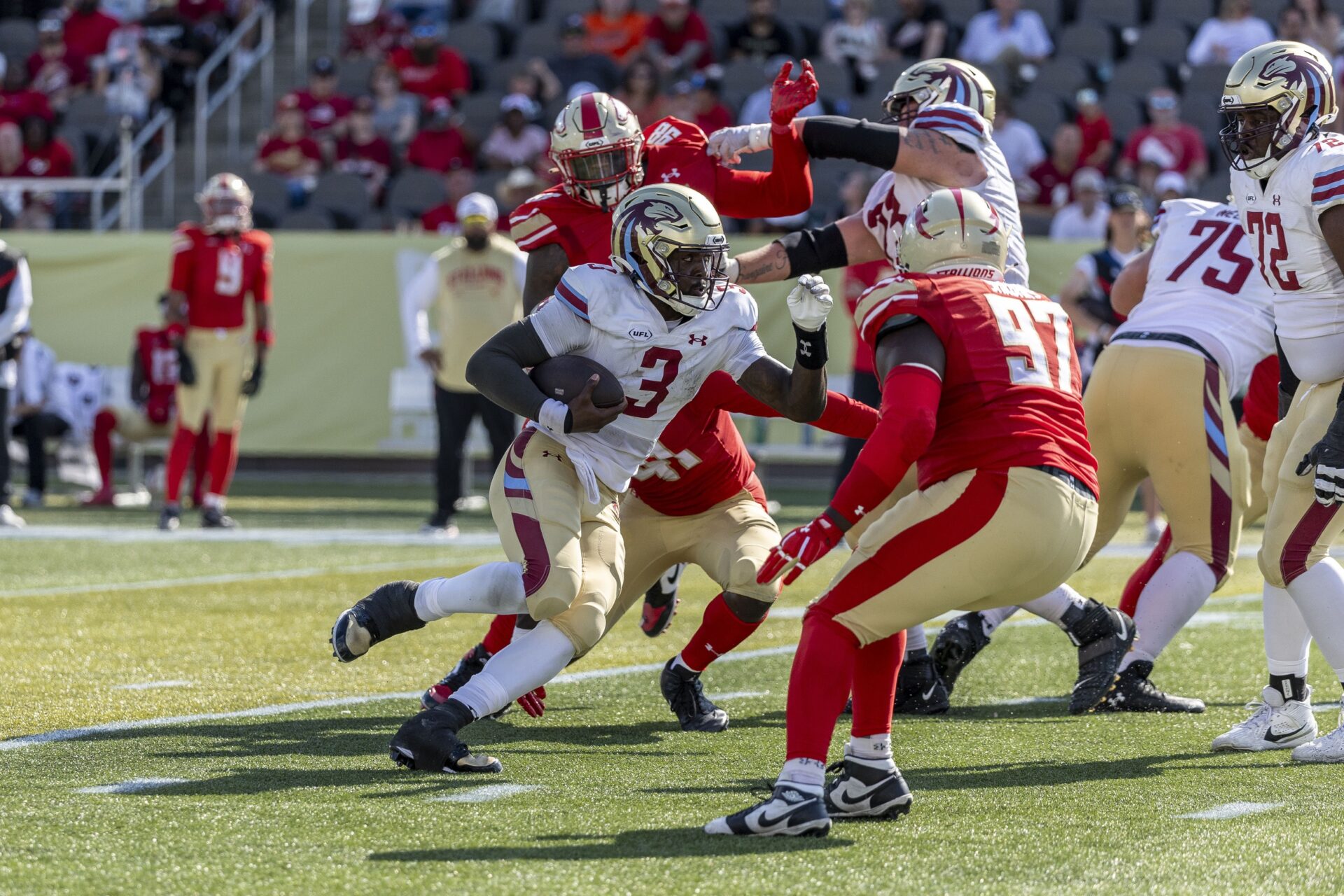 Jun 8, 2025; Birmingham, AL, USA; Michigan Panthers quarterback Bryce Perkins (3) runs the ball against Birmingham Stallions defensive lineman Willie Yarbary (97) during the second half of the USFL conference championship football game at Protective Stadium.