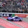 Jun 8, 2025; Brooklyn, Michigan, USA; NASCAR Cup Series driver Denny Hamlin (11) crosses the finish line to win the FireKeepers Casino 400 at Michigan International Speedway.