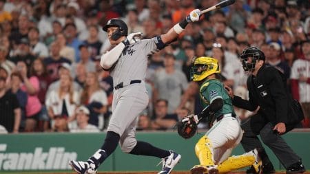 Jun 13, 2025; Boston, Massachusetts, USA; New York Yankees outfielder Aaron Judge (99) hits a home run against the Boston Red Sox in the ninth inning at Fenway Park.