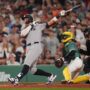 Jun 13, 2025; Boston, Massachusetts, USA; New York Yankees outfielder Aaron Judge (99) hits a home run against the Boston Red Sox in the ninth inning at Fenway Park.