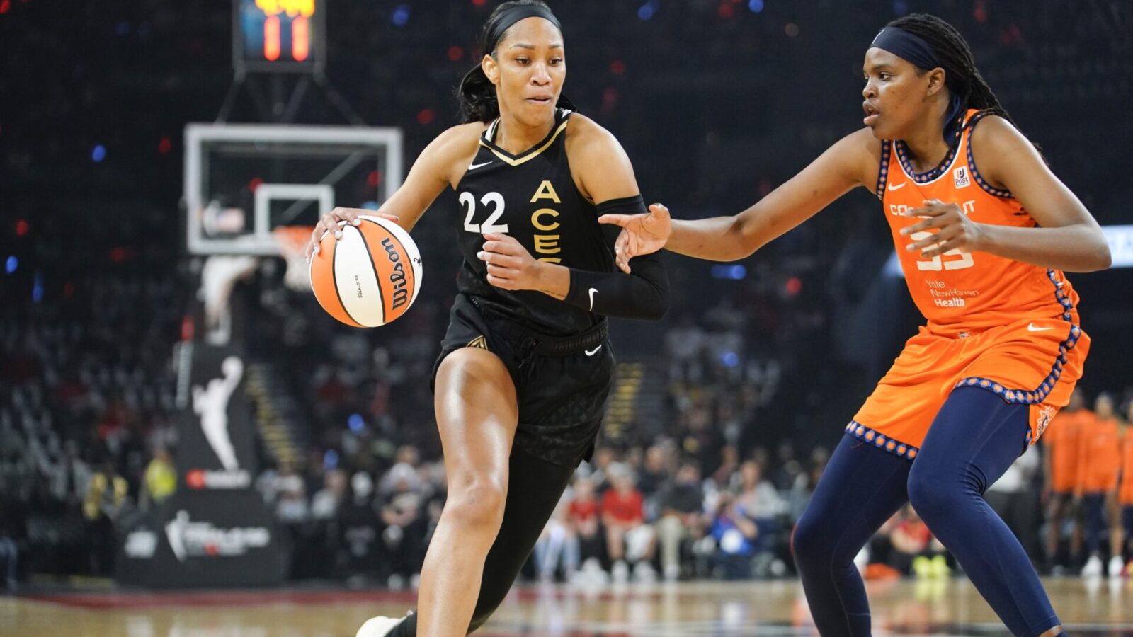 Sep 11, 2022; Las Vegas, Nevada, USA; Las Vegas Aces forward Aja Wilson (22) drives the ball against Connecticut Sun forward Jonquel Jones (35) in the first quarter during game one of the 2022 WNBA Finals at Michelob Ultra Arena.