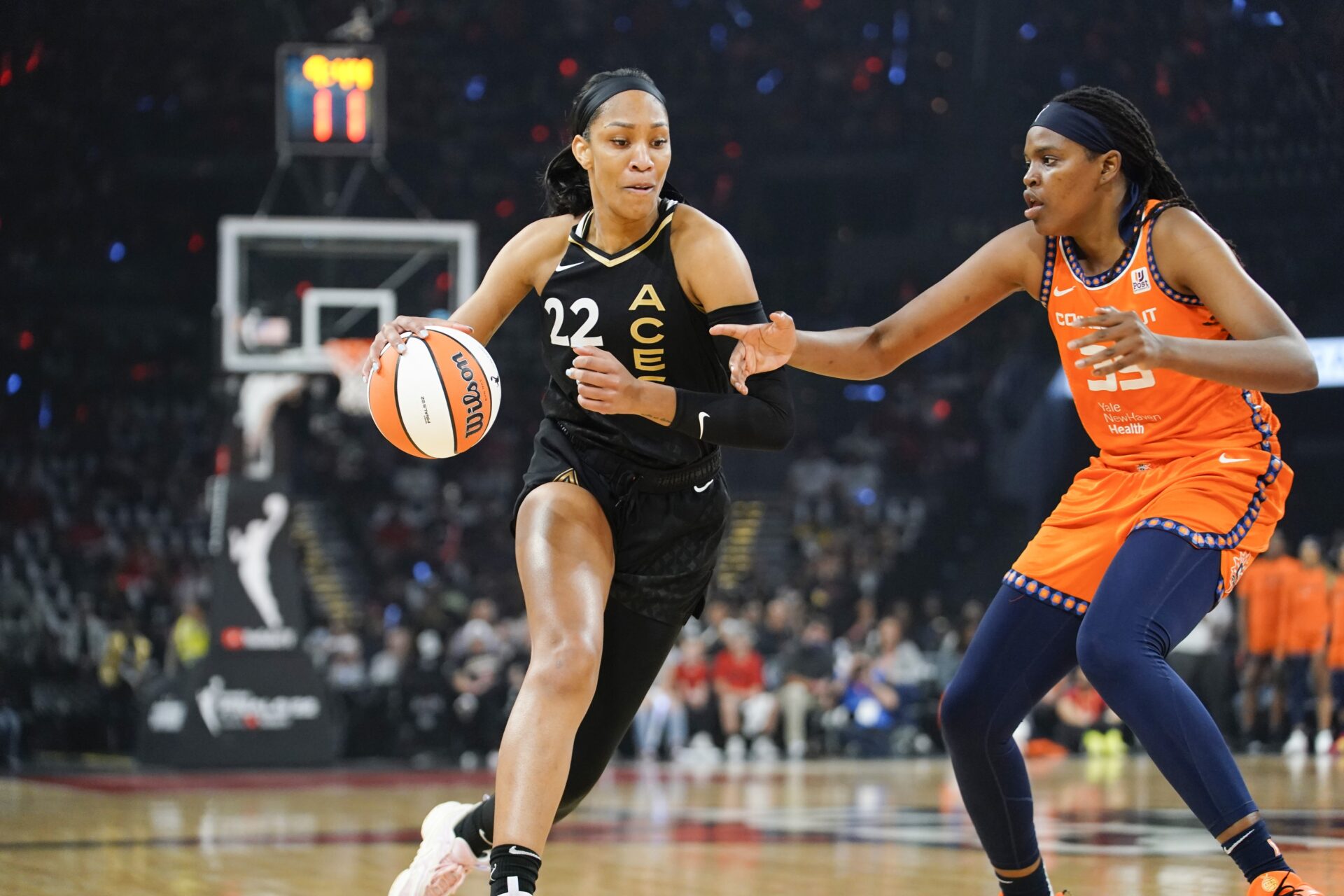 Sep 11, 2022; Las Vegas, Nevada, USA; Las Vegas Aces forward Aja Wilson (22) drives the ball against Connecticut Sun forward Jonquel Jones (35) in the first quarter during game one of the 2022 WNBA Finals at Michelob Ultra Arena.