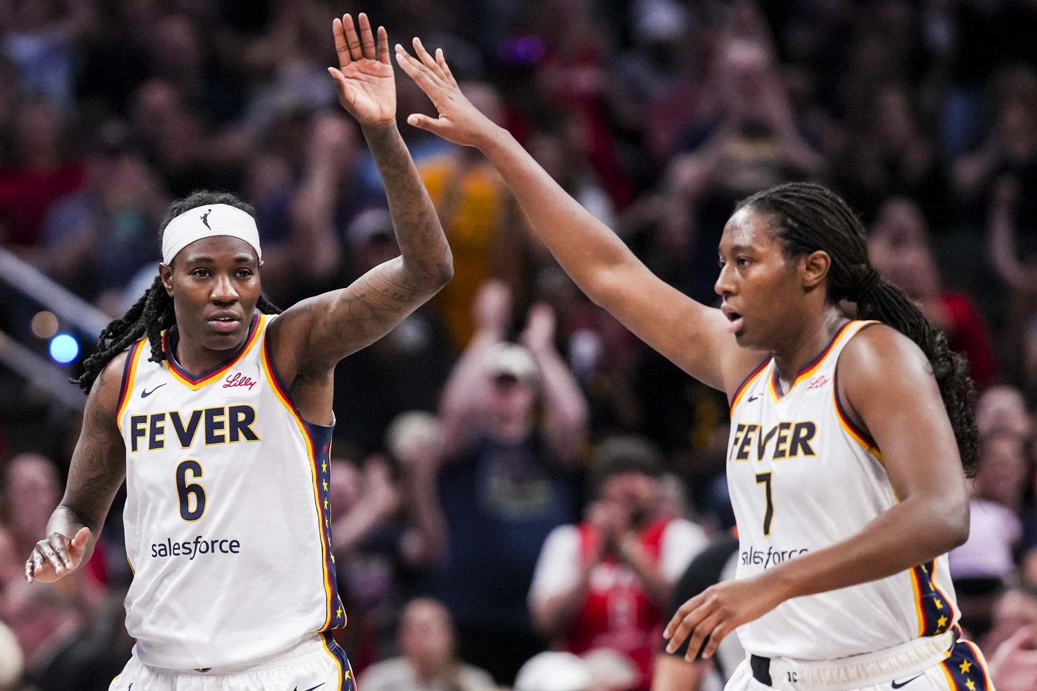 May 24, 2025; Indianapolis, Indiana, USA; Indiana Fever forwards Natasha Howard (6) and Aliyah Boston (7) high five during a game between the Indiana Fever and the New York Libertyat Gainbridge Fieldhouse.