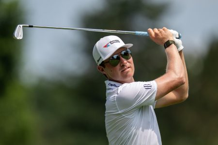 PGA Tour pro Ben Griffin hits his ball from the 9th tee box during the second round of the Rocket Classic at the Detroit Golf Club in Detroit on Friday, June 27, 2025.