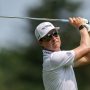PGA Tour pro Ben Griffin hits his ball from the 9th tee box during the second round of the Rocket Classic at the Detroit Golf Club in Detroit on Friday, June 27, 2025.