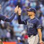 May 15, 2025; Toronto, Ontario, CAN; Tampa Bay Rays second base Brandon Lowe (8) celebrates defeating the Toronto Blue Jays with Josh Lowe (15) at Rogers Centre.