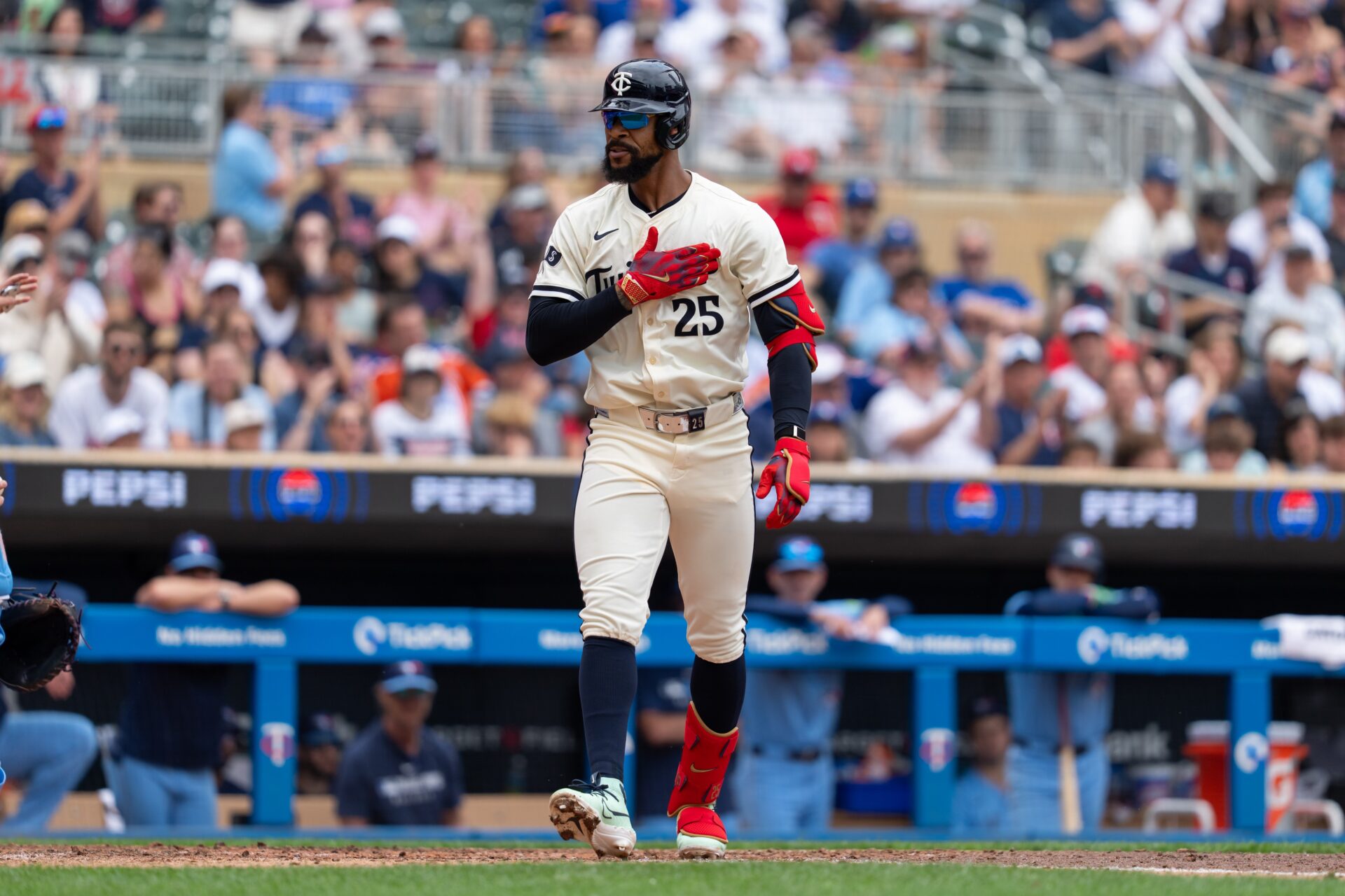 Jun 8, 2025; Minneapolis, Minnesota, USA; Minnesota Twins center fielder Byron Buxton (25) reacts to getting walked during the fifth inning against the Toronto Blue Jays at Target Field.