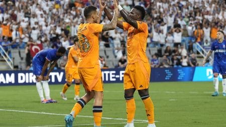Real Madrid midfielder Dani Ceballos (19) celebrates his goal with forward Rodrygo (11) during the first half against Chelsea at Bank of America Stadium.