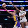 May 25, 2025; Los Angeles, California, USA; LA Sparks guard Kelsey Plum (10) shoots the ball against Chicago Sky forward Angel Reese (5) in the first half at Crypto.com Arena.