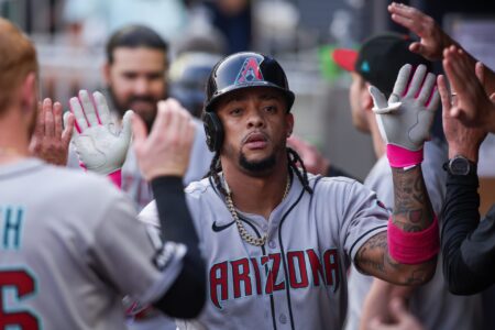 Jun 3, 2025; Atlanta, Georgia, USA; Arizona Diamondbacks second baseman Ketel Marte (4) celebrates with teammates after a two-run home run against the Atlanta Braves in the third inning at Truist Park.