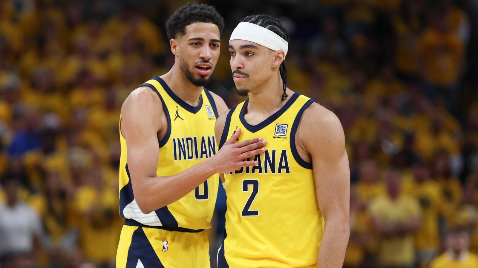 May 31, 2025; Indianapolis, Indiana, USA; Indiana Pacers guard Tyrese Haliburton (0) and guard Andrew Nembhard (2) speak in the second quarter during game six of the eastern conference finals against the New York Knicks for the 2025 NBA Playoffs at Gainbridge Fieldhouse.