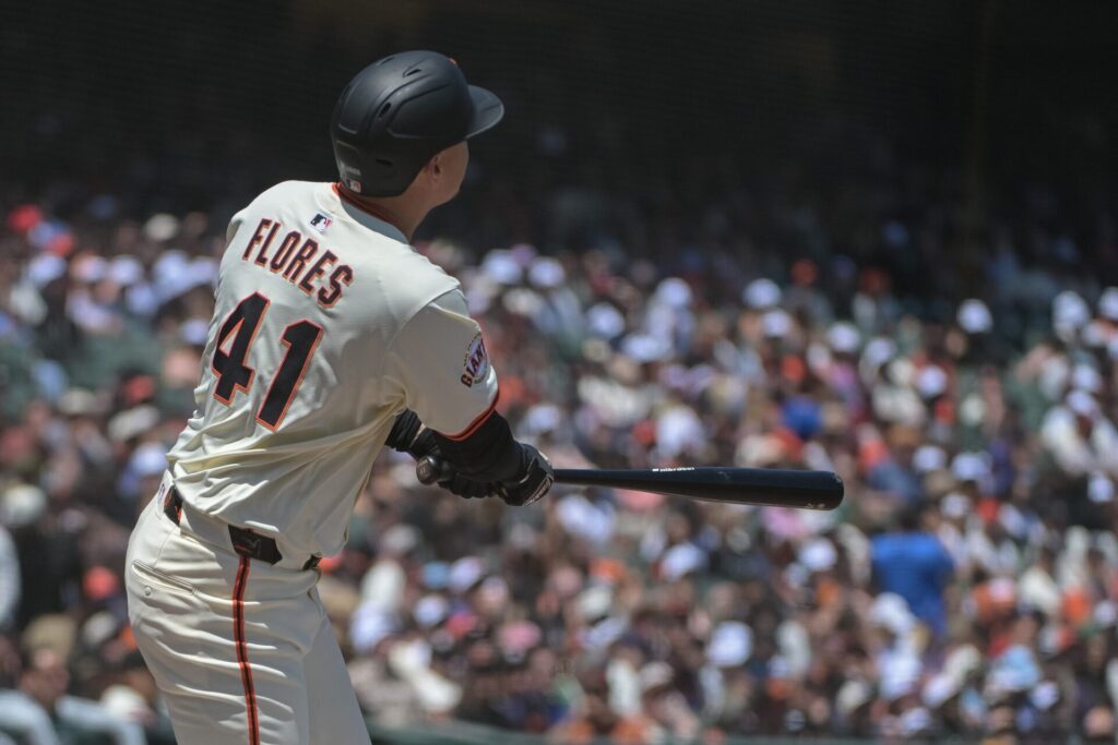 Jun 7, 2025; San Francisco, California, USA; San Francisco Giants first baseman Wilmer Flores (41) hits a home run against the Atlanta Braves during the fourth inning at Oracle Park.