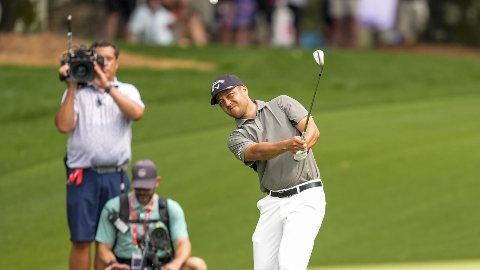 May 16, 2025; Charlotte, North Carolina, USA; Xander Schauffele pitches up to the ninth hole during the second round of the PGA Championship golf tournament at Quail Hollow.