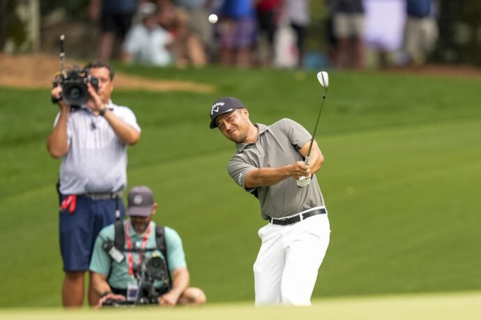 May 16, 2025; Charlotte, North Carolina, USA; Xander Schauffele pitches up to the ninth hole during the second round of the PGA Championship golf tournament at Quail Hollow.