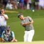 May 16, 2025; Charlotte, North Carolina, USA; Xander Schauffele pitches up to the ninth hole during the second round of the PGA Championship golf tournament at Quail Hollow.