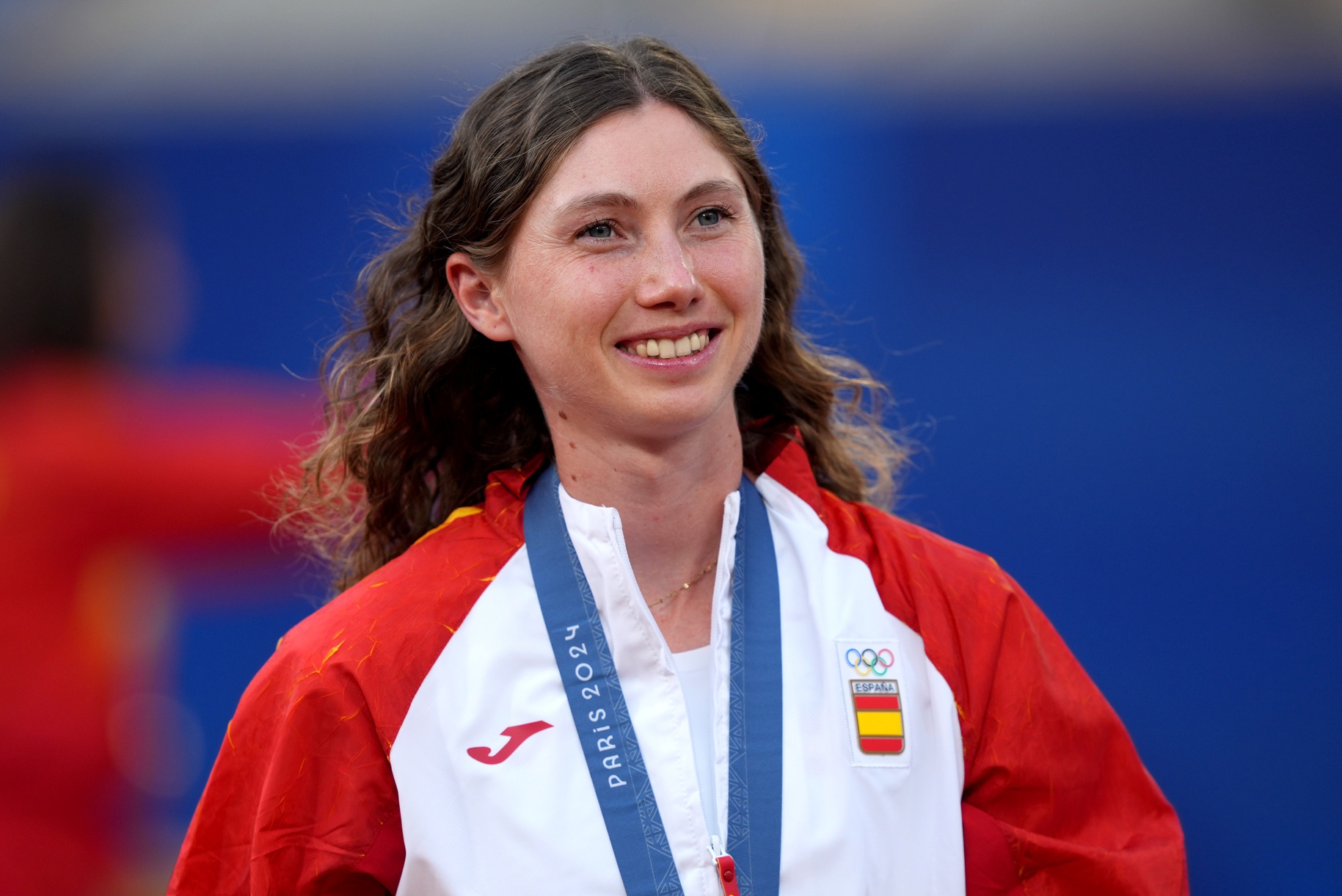 Aug 4, 2024; Paris, France; Cristina Bucsa (ESP) celebrates after receiving her bronze medal for women’s doubles during the Paris 2024 Olympic Summer Games at Stade Roland Garros.