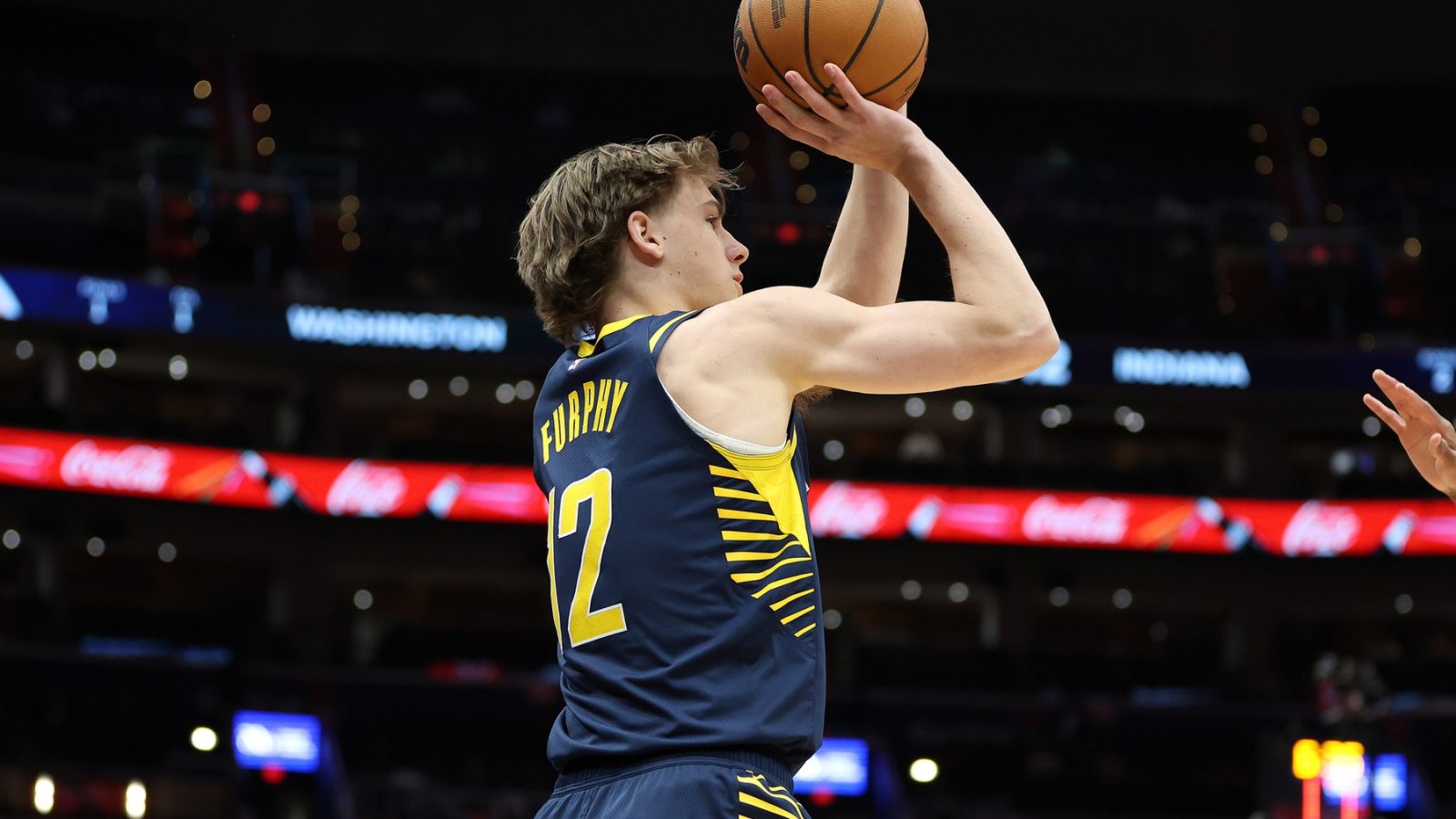 Mar 27, 2025; Washington, District of Columbia, USA; Indiana Pacers forward Johnny Furphy (12) shoots during the second half against the Washington Wizards at Capital One Arena.