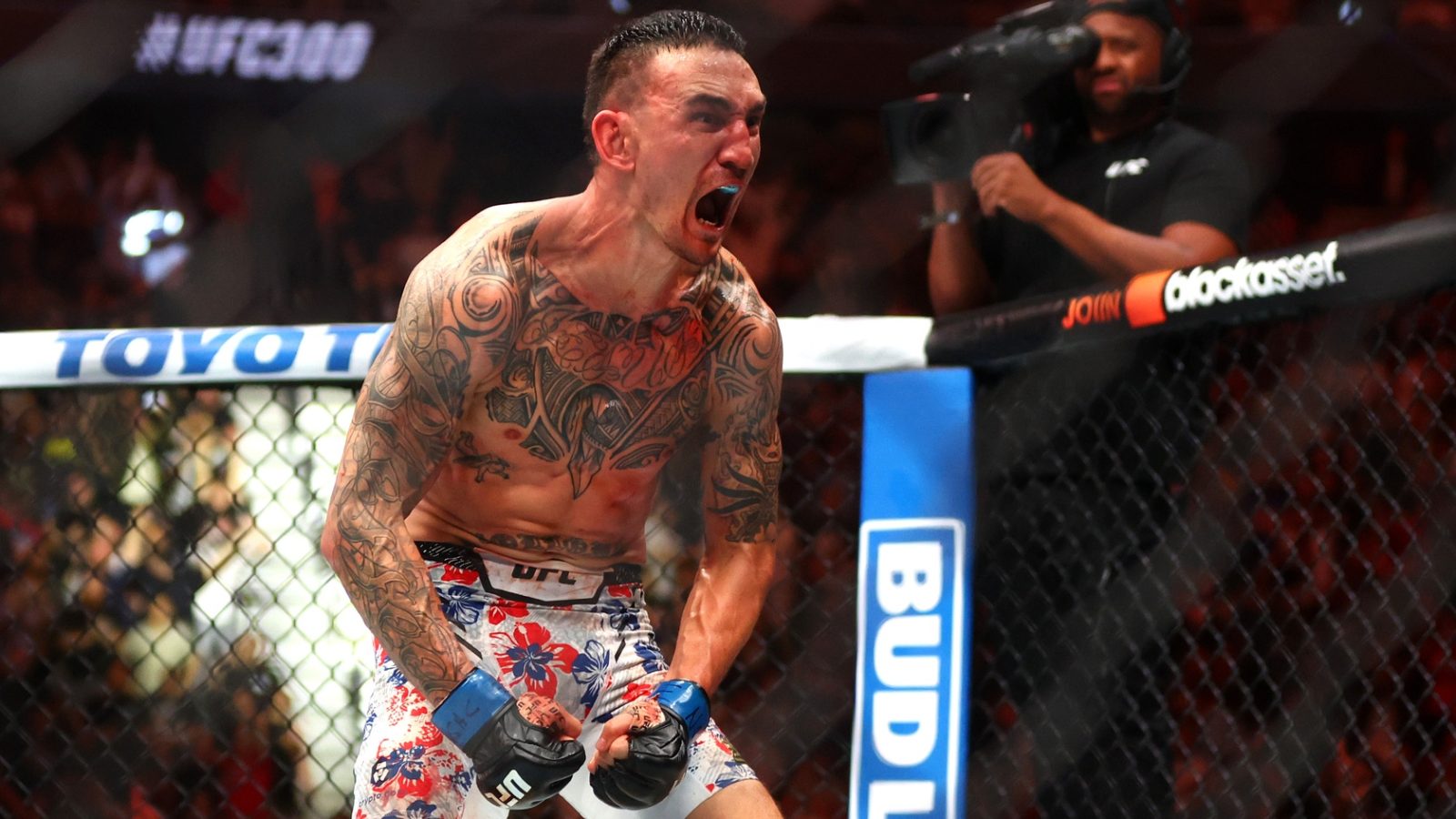 Apr 13, 2024; Las Vegas, Nevada, USA; Max Holloway (blue gloves) reacts after defeating Justin Gaethje (not pictured) during UFC 300 at T-Mobile Arena. Holloway is one of our best UFC props for this weekend.